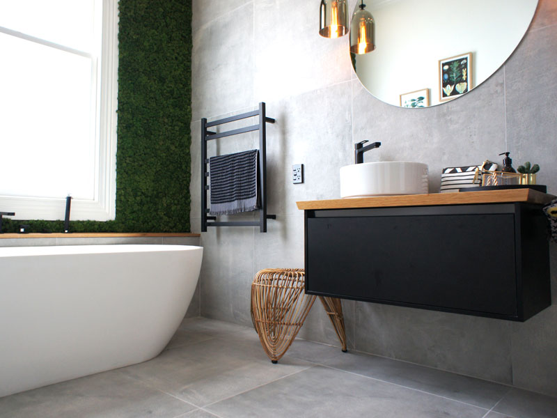 concrete look bathroom with moss green wall